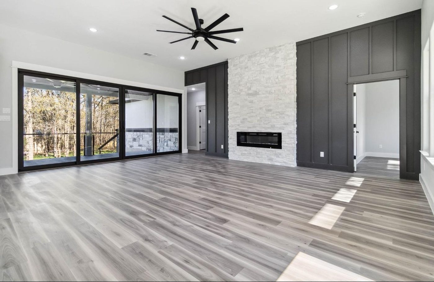 Living room with stacked stone fireplace
