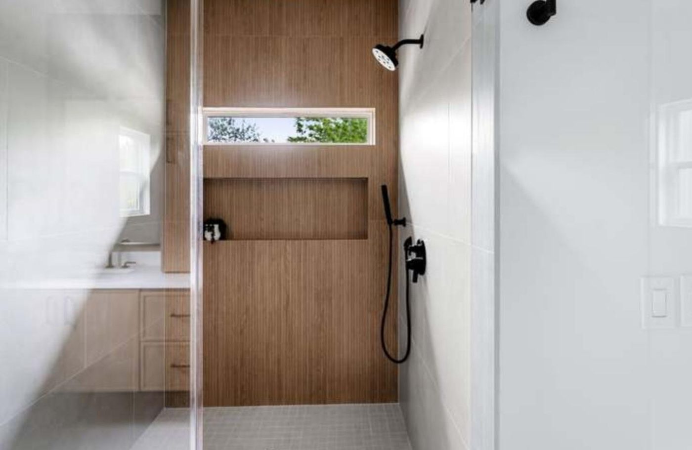 Walk-in shower with wood-slat accent wall